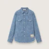 Camisas unisex «Journey» de cambray de algodón azul claro con bajo con flecos y parche bordado