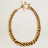 Collar de cadena escalonada en oro antiguo con cierre en forma de estrella