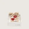Cordones dorados «Pieles» de CNY con dijes rojos y cristales