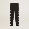 Leggings negros para niñas con estrellas blancas en los laterales