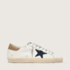 Super-Star para hombre en piel blanca con estrella de lona azul medianoche y lengüeta del talón en piel color tabaco