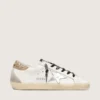 Zapatillas Super-Star de piel blanca para mujer con lengüeta dorada brillante en el talón