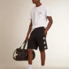 Bermudas negras de hombre con estrellas blancas