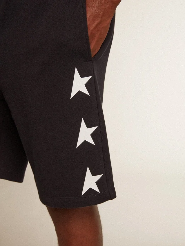 Bermudas negras de hombre con estrellas blancas
