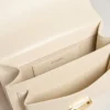 Bolso Venezia en piel repujada color mantequilla con doble colgante