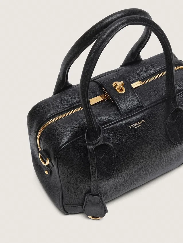 Bolso Vita en piel de oveja negra con detalles dorados