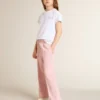 Camisas blancas y plateadas con logotipo y estrella grande con purpurina plateada