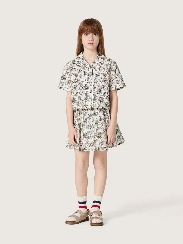 Minifalda para niñas «Journey» de lona de algodón blanca con estampado floral verde