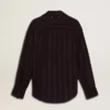 Camisas negras de mujer con rayas verticales y cierre con nudo lateral
