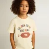 Camisas para niños en blanco desgastado con letras multicolores