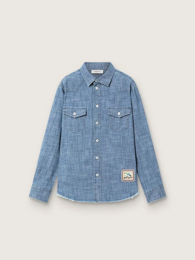 Camisas unisex «Journey» de cambray de algodón azul claro con bajo con flecos y parche bordado