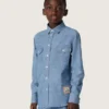 Camisas unisex «Journey» de cambray de algodón azul claro con bajo con flecos y parche bordado