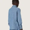 Camisas unisex «Journey» de cambray de algodón azul claro con bajo con flecos y parche bordado