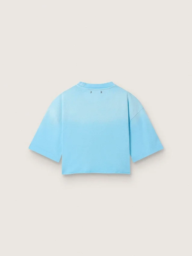 Camiseta corta de mujer en jersey de algodón azul claro con estampado gráfico