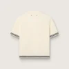 Camiseta de punto blanca para mujer con ribetes en contraste y broche extraíble