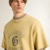 Camiseta oversize de algodón amarilla para hombre con estampado azul