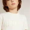 Camiseta para niños de color crema con logotipo en relieve