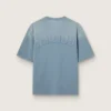 Camiseta unisex de algodón en azul claro con estampado invertido en la espalda