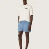 Camiseta unisex de la colección Resort, de algodón blanco con estampado y logotipo