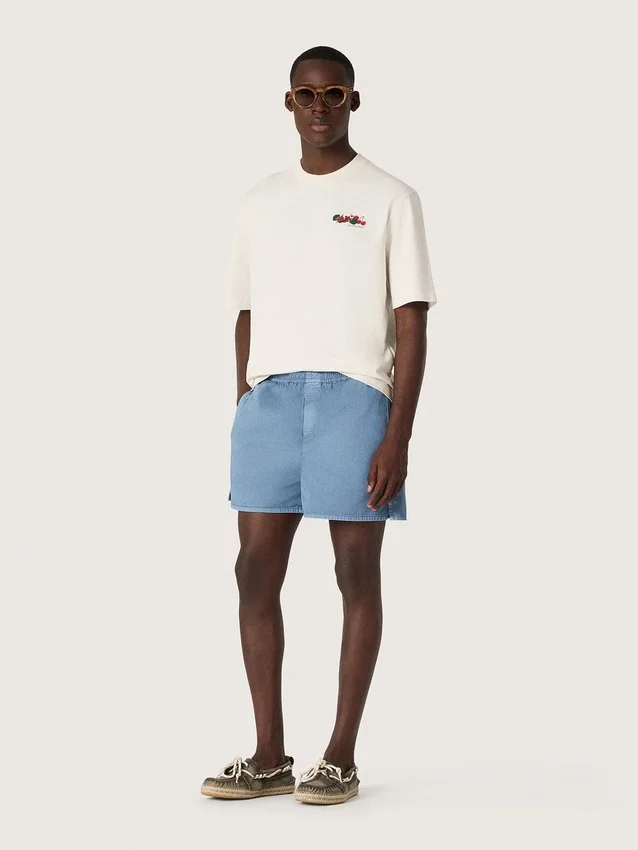 Camiseta unisex de la colección Resort, de algodón blanco con estampado y logotipo