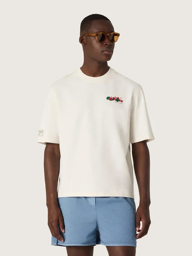 Camiseta unisex de la colección Resort, de algodón blanco con estampado y logotipo