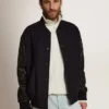 Chaqueta bomber de hombre de lana azul oscuro con mangas de cuero