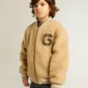 Chaqueta bomber infantil de forro polar en color beige