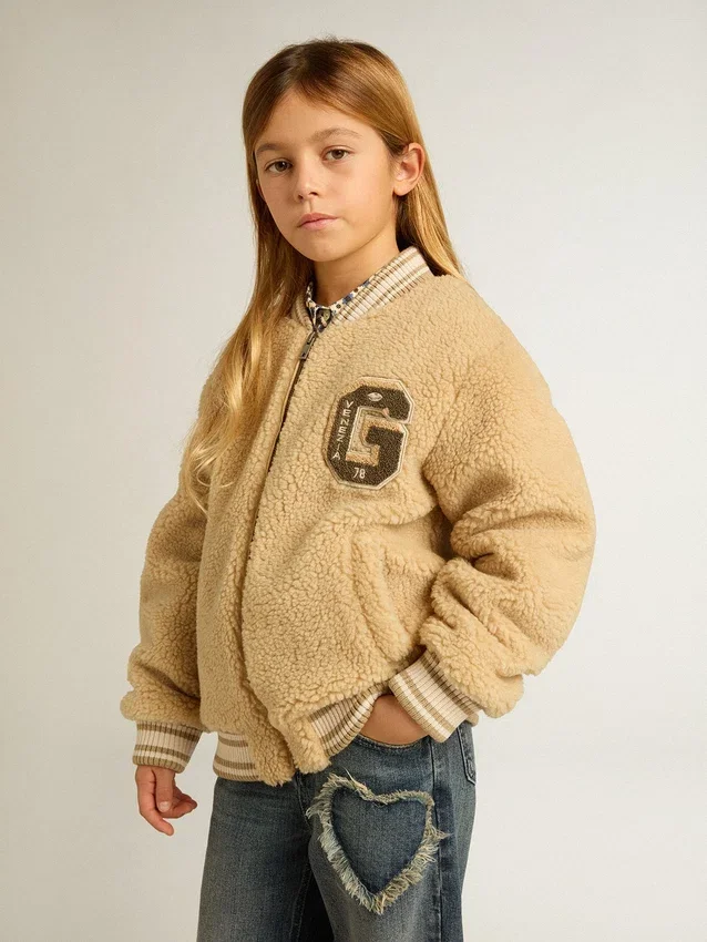 Chaqueta bomber infantil de forro polar en color beige