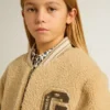 Chaqueta bomber infantil de forro polar en color beige