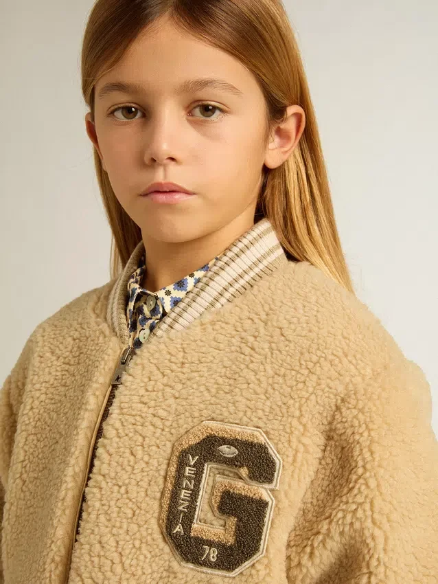 Chaqueta bomber infantil de forro polar en color beige