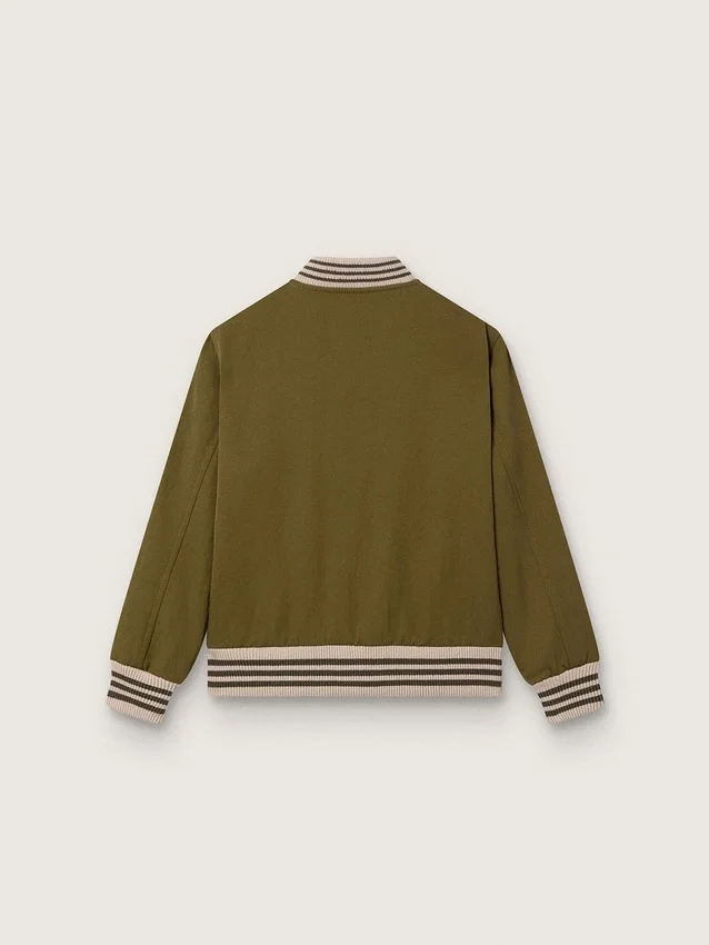 Chaqueta bomber unisex Journey en sarga de nailon verde militar con parche bordado