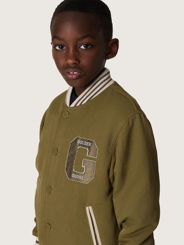 Chaqueta bomber unisex Journey en sarga de nailon verde militar con parche bordado