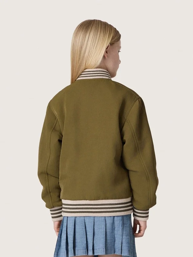 Chaqueta bomber unisex Journey en sarga de nailon verde militar con parche bordado