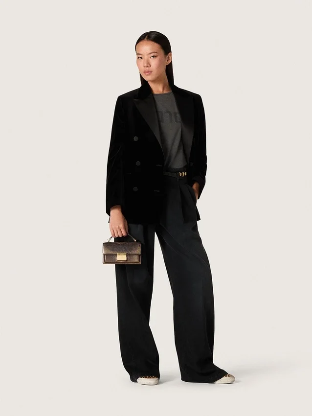 Pantalones de mujer de denim de algodón negro con acabado desgastado