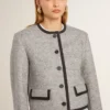 Chaqueta de mujer de lana y seda gris con ribetes de ante negro