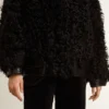 Chaqueta de piel de oveja negra para mujer