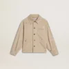 Chaqueta infantil de color beige con salpicaduras multicolores