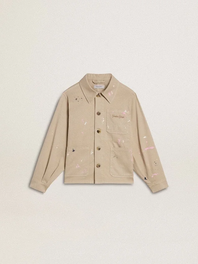 Chaqueta infantil de color beige con salpicaduras multicolores
