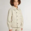 Chaqueta infantil de color beige con salpicaduras multicolores