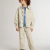Chaqueta infantil de color beige con salpicaduras multicolores