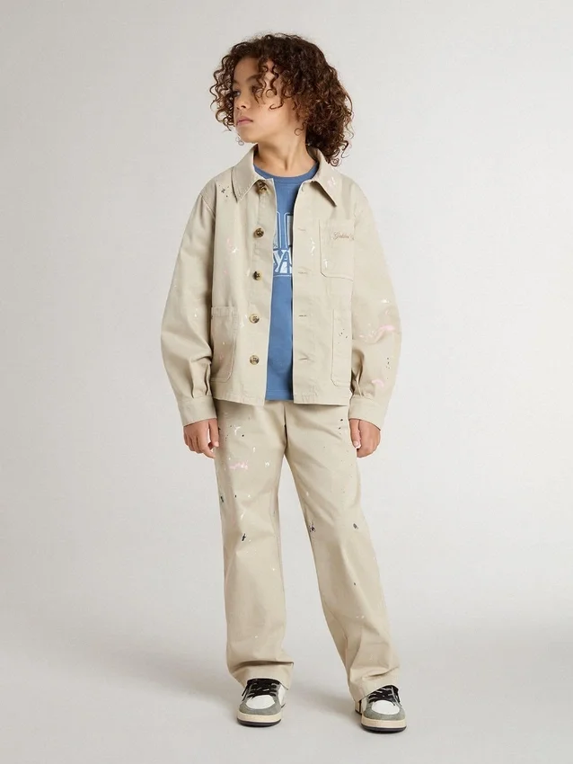 Chaqueta infantil de color beige con salpicaduras multicolores