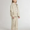 Chaqueta infantil de color beige con salpicaduras multicolores