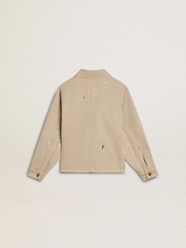 Chaqueta infantil de color beige con salpicaduras multicolores