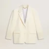 Chaqueta oversize de un solo pecho en color blanco con efecto seda y bordados
