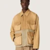 Chaqueta safari unisex de algodón en tonos beige y verde militar con bolsillos extragrandes