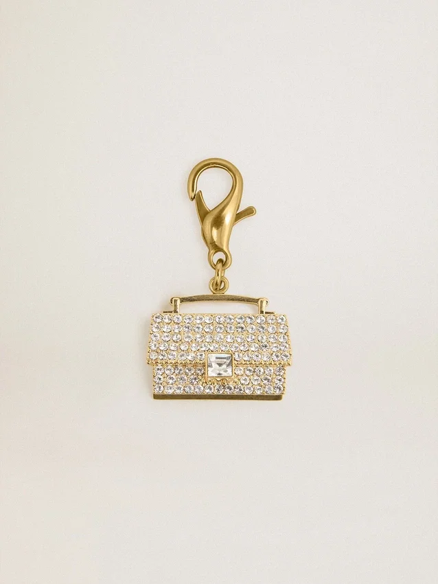 Colgante con forma de bolso de latón dorado con cristales