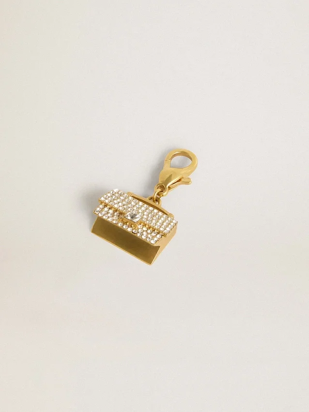 Colgante con forma de bolso de latón dorado con cristales