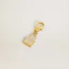 Colgante con forma de candado de latón dorado con cristales