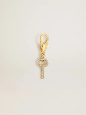 Colgante con forma de llave de latón dorado con cristales