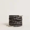 Cordones de algodón negros con estrellas plateadas en contraste